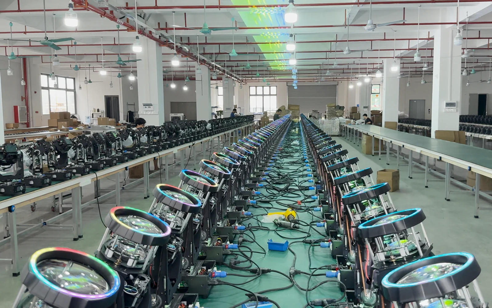 Beam moving head fixtures arranged for powered workshop checks