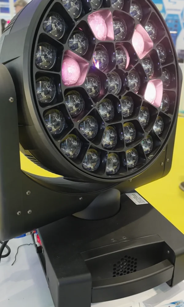 Trade-show side view of bee eye moving head with pink LEDs