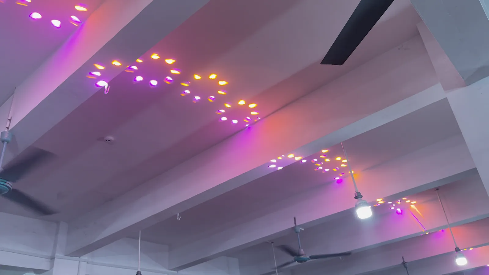 380W Indoor Beam Moving Head Light — Multicolored beam pattern projected onto an indoor ceiling in supplied product material