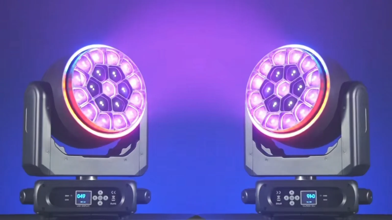 Two bee-eye moving heads showing purple lens effects and RGB rings