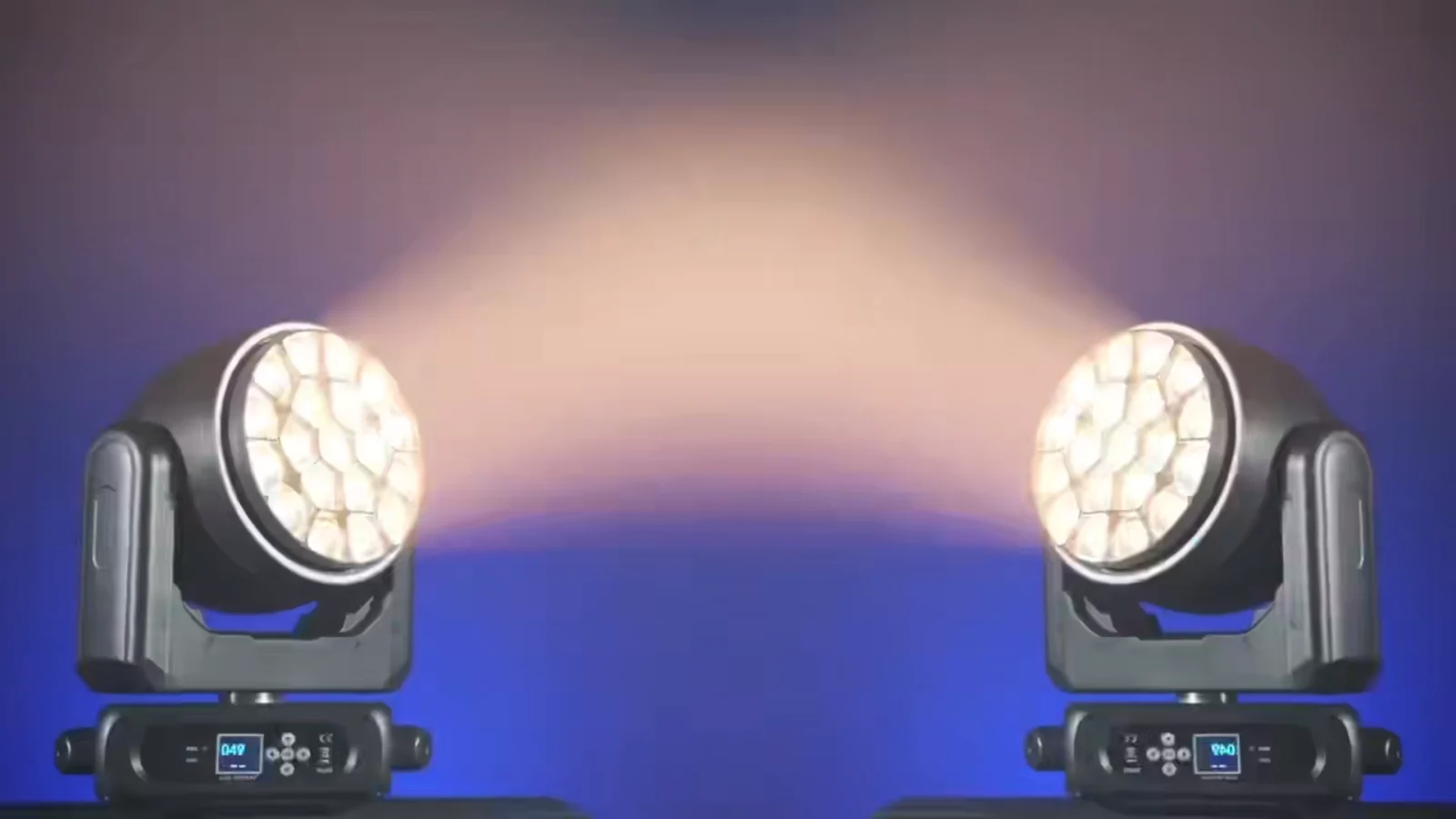 Two bee-eye moving heads producing warm white output