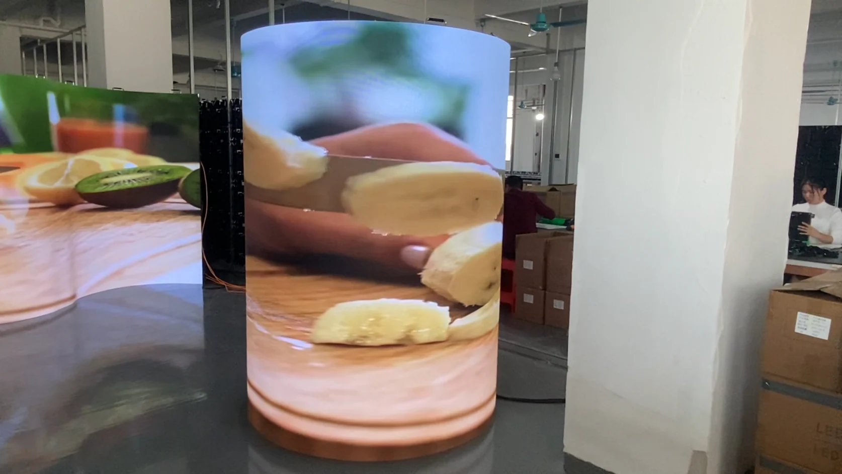 Indoor flexible LED cabinets assembled as a curved cylindrical display in the workshop