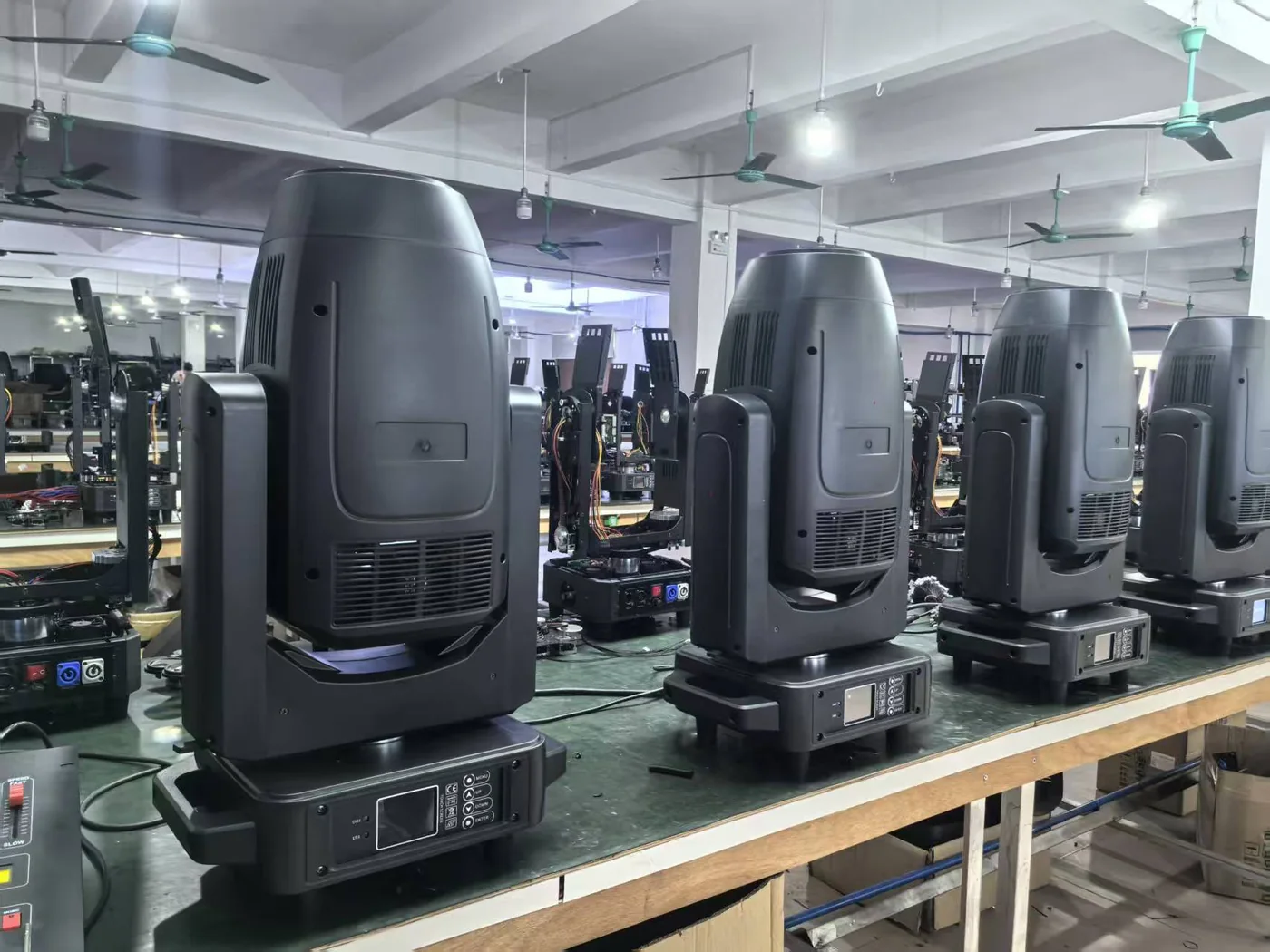 LED moving head fixtures on the production check bench