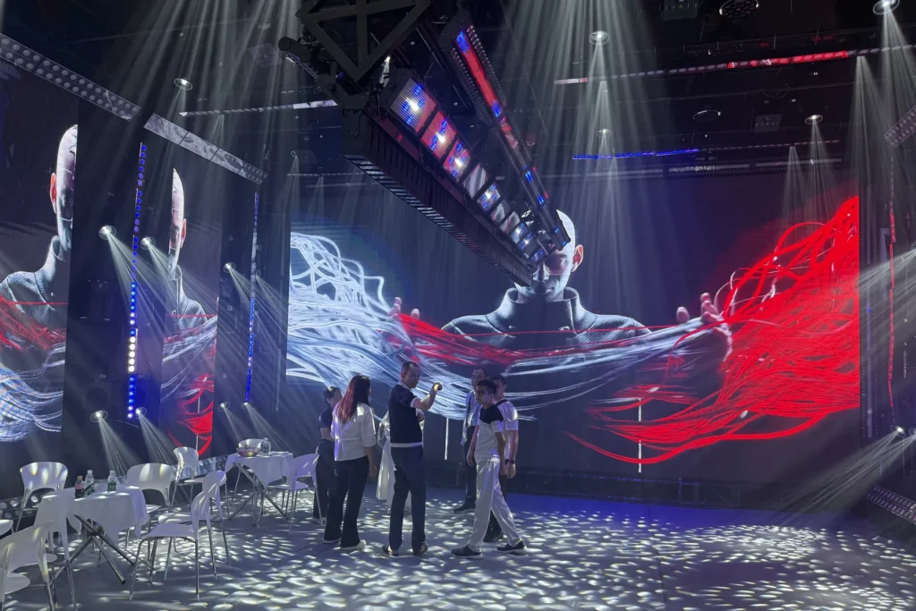 Visitors viewing immersive LED display content at the WUYESTAGE Guangzhou exhibition booth