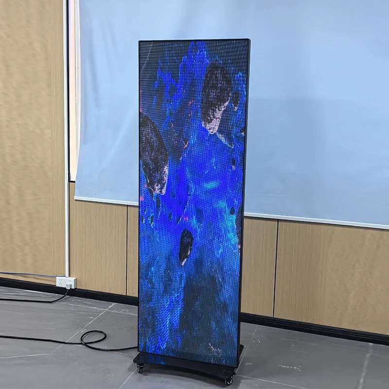 Angled live view of an indoor LED poster screen showing video content