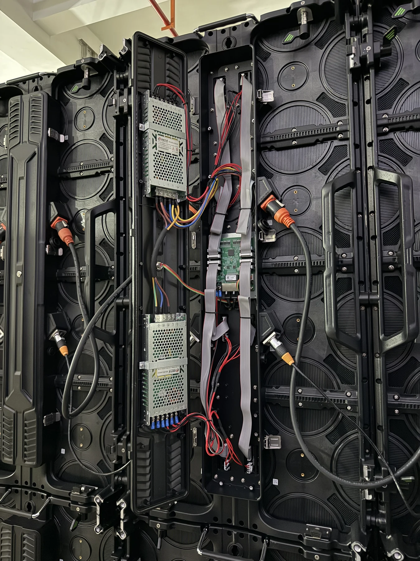Open P3.91 rental LED cabinets showing power supplies receiving card and internal cabling