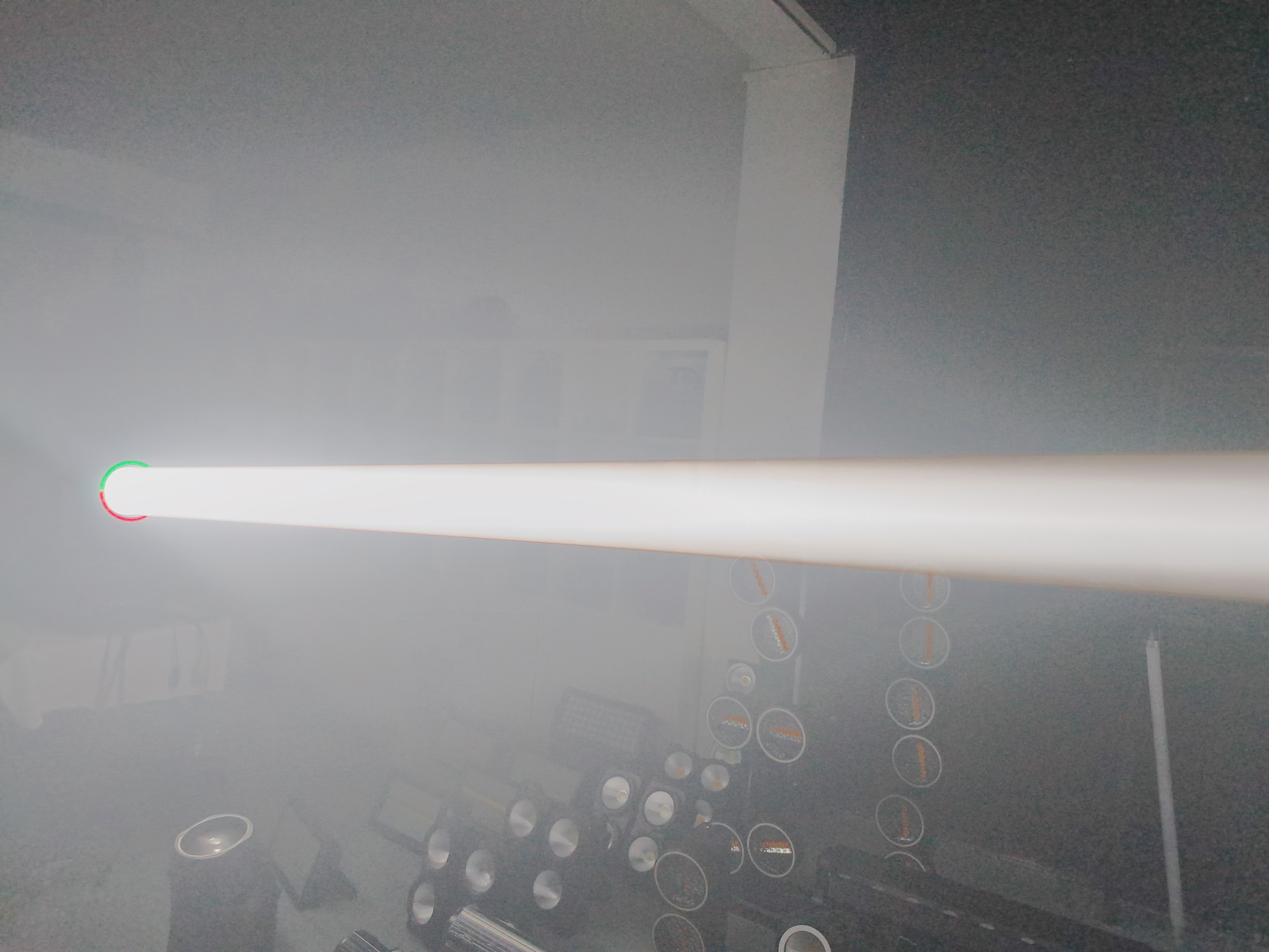 White beam photographed in haze inside a demonstration room