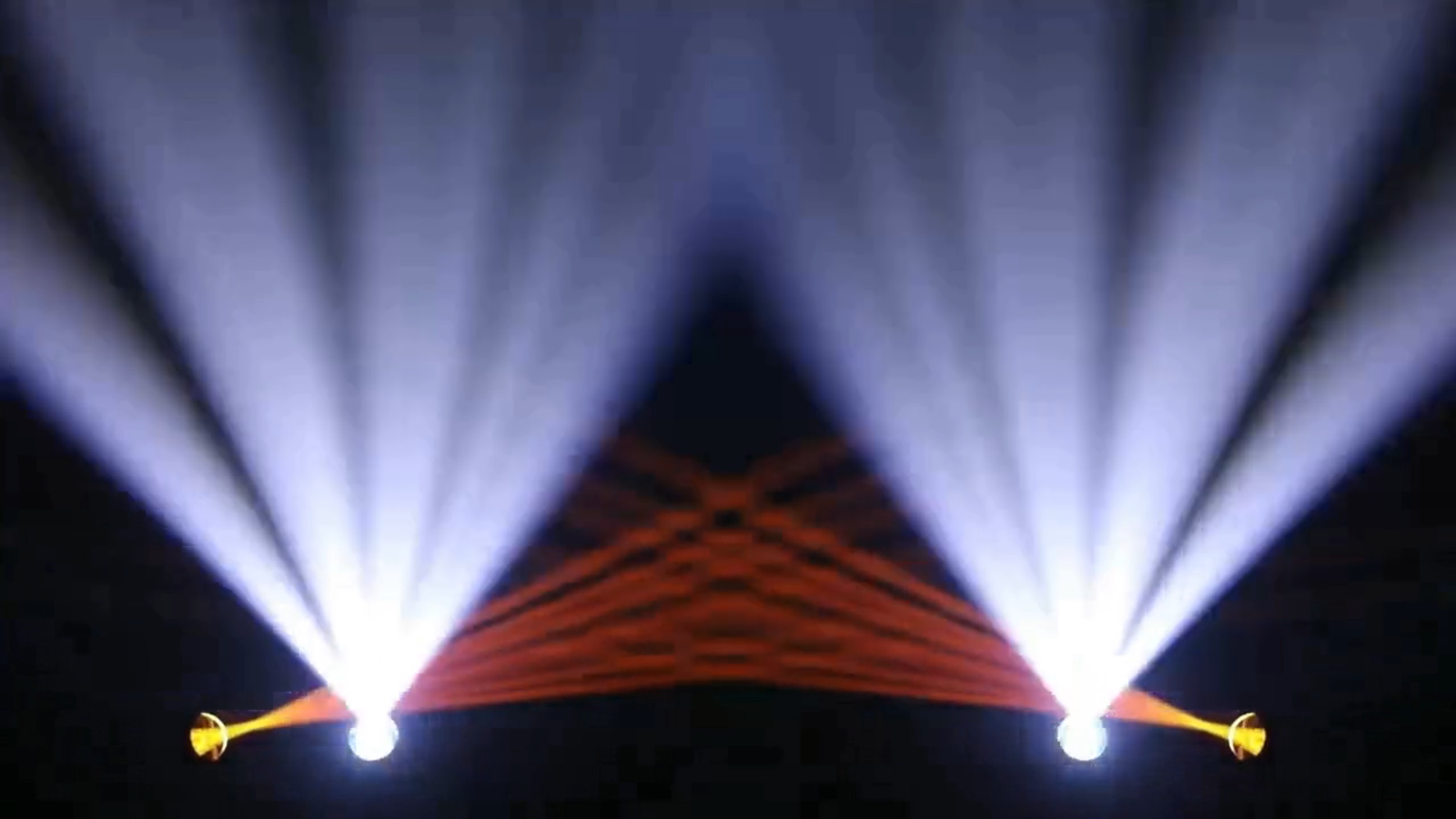 Two white beam fans with colored beams crossing behind them