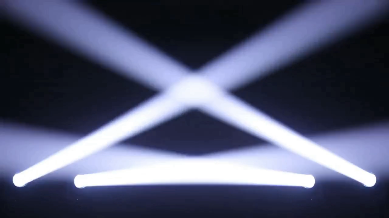 Crossing white beams from multiple fixtures in the lighting demonstration