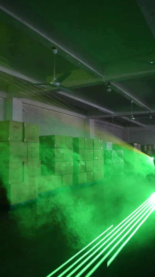 Green laser fan shown in an indoor demonstration