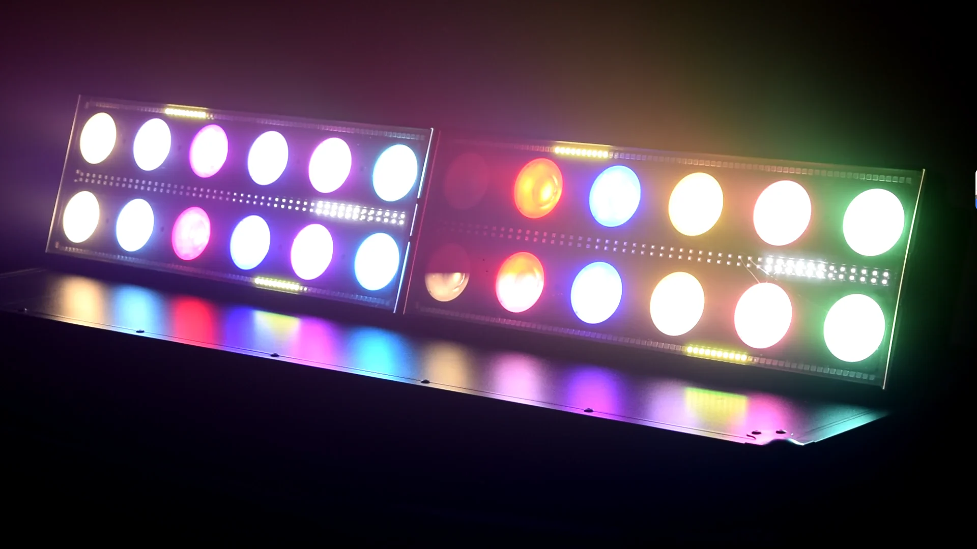 Two RGBW stage effect lights joined side by side with multicolor output