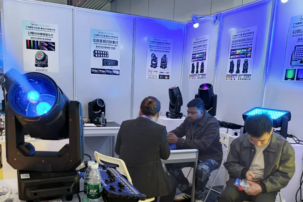 Moving head light display and visitor meetings at the WUYESTAGE Shenzhen exhibition booth
