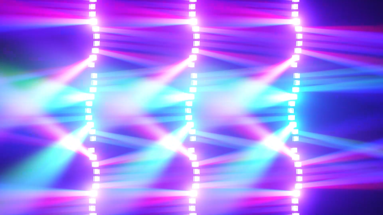 Cyan and magenta beam patterns from three vertical fixture rows
