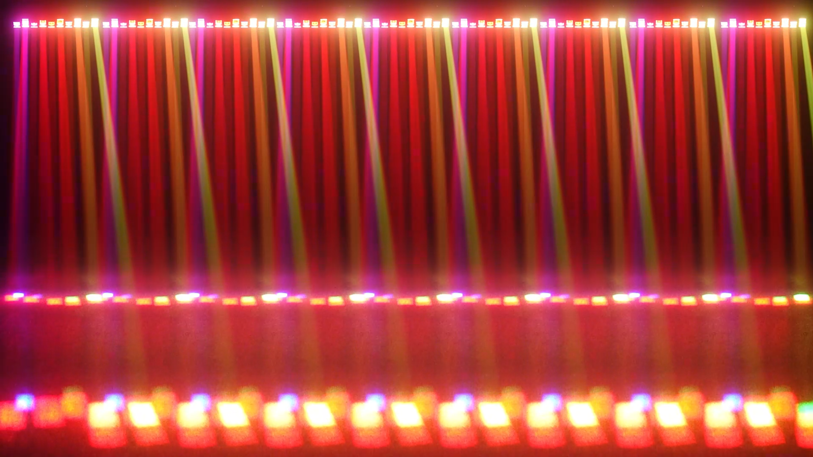 Red orange and yellow beam curtain across a row of fixtures