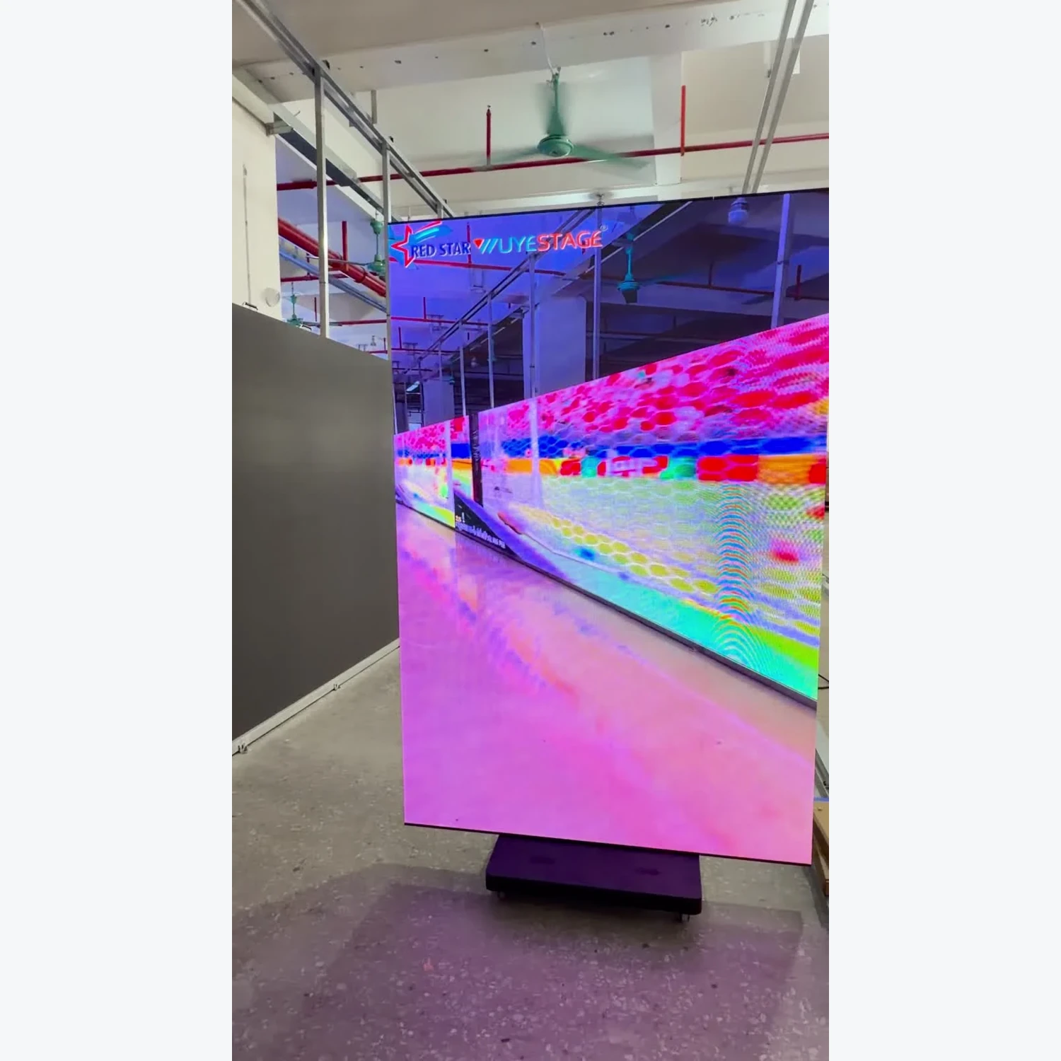 LED display showing colorful video content in a workshop, captured from the product demonstration
