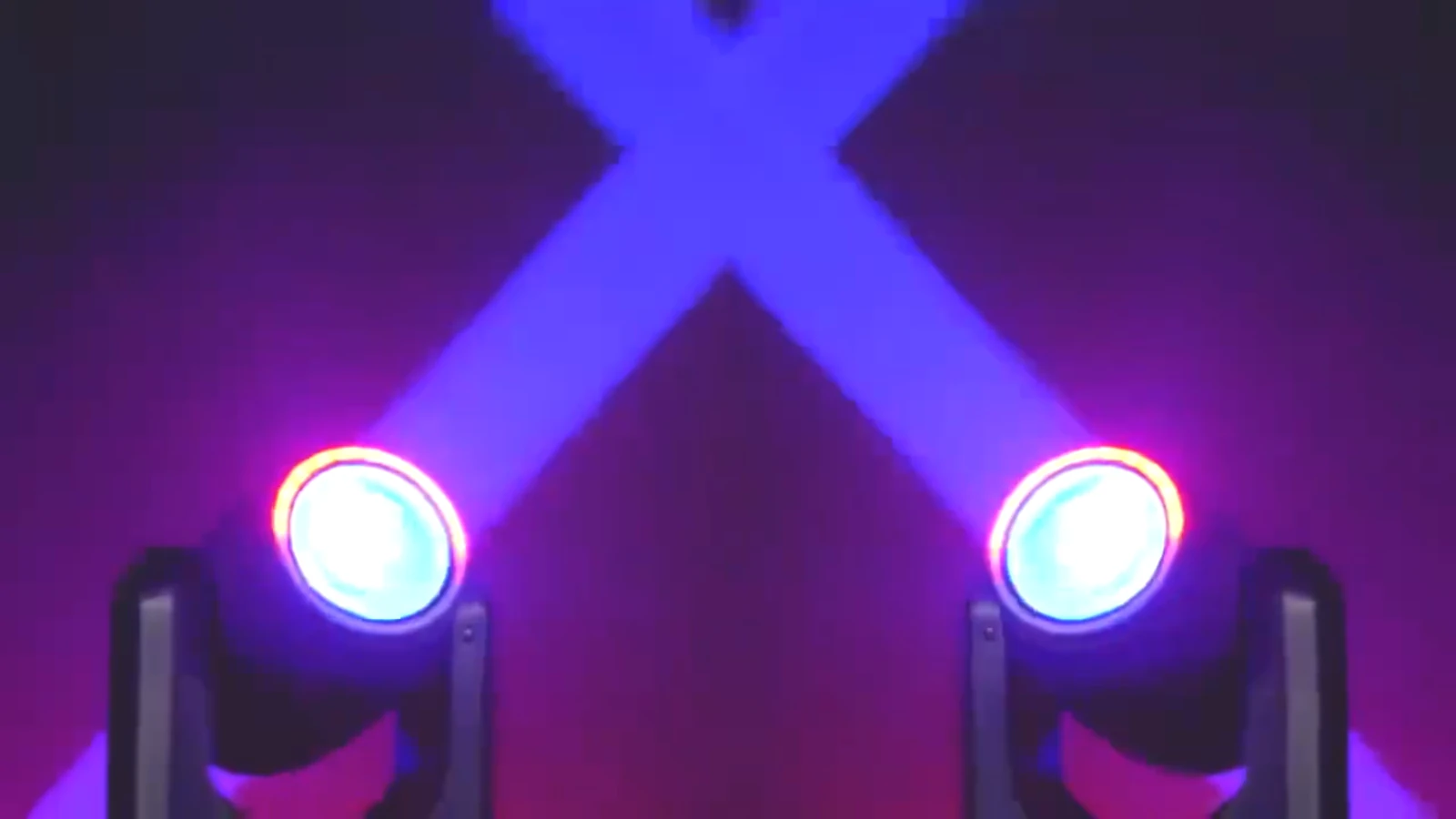 Two RG-218 fixtures producing crossed blue beams with illuminated rings