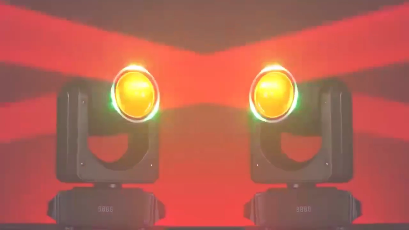 Two RG-218 fixtures with yellow lens faces and opposing red beams