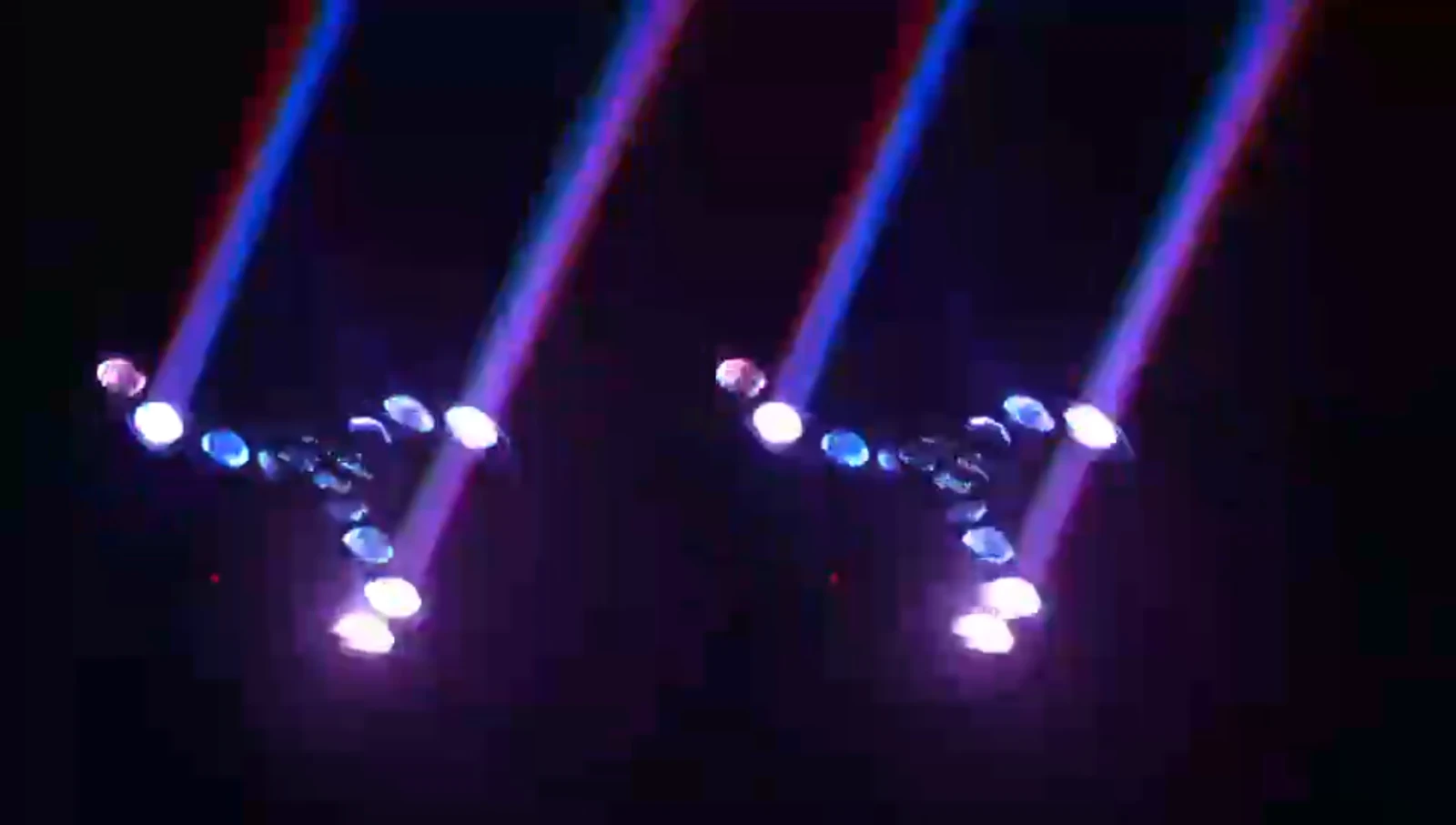 Supplied paired fixture demonstration showing selected colored beam looks