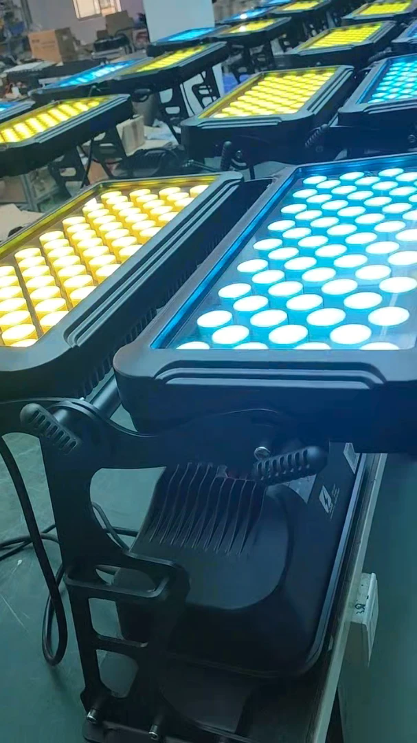 User-confirmed RG-302 production-scene photograph showing fixtures illuminated cyan and yellow
