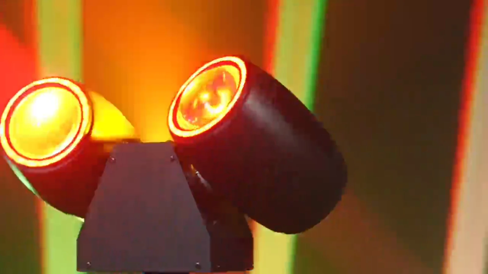Supplied close-up of twin illuminated lenses and colorful rim accents