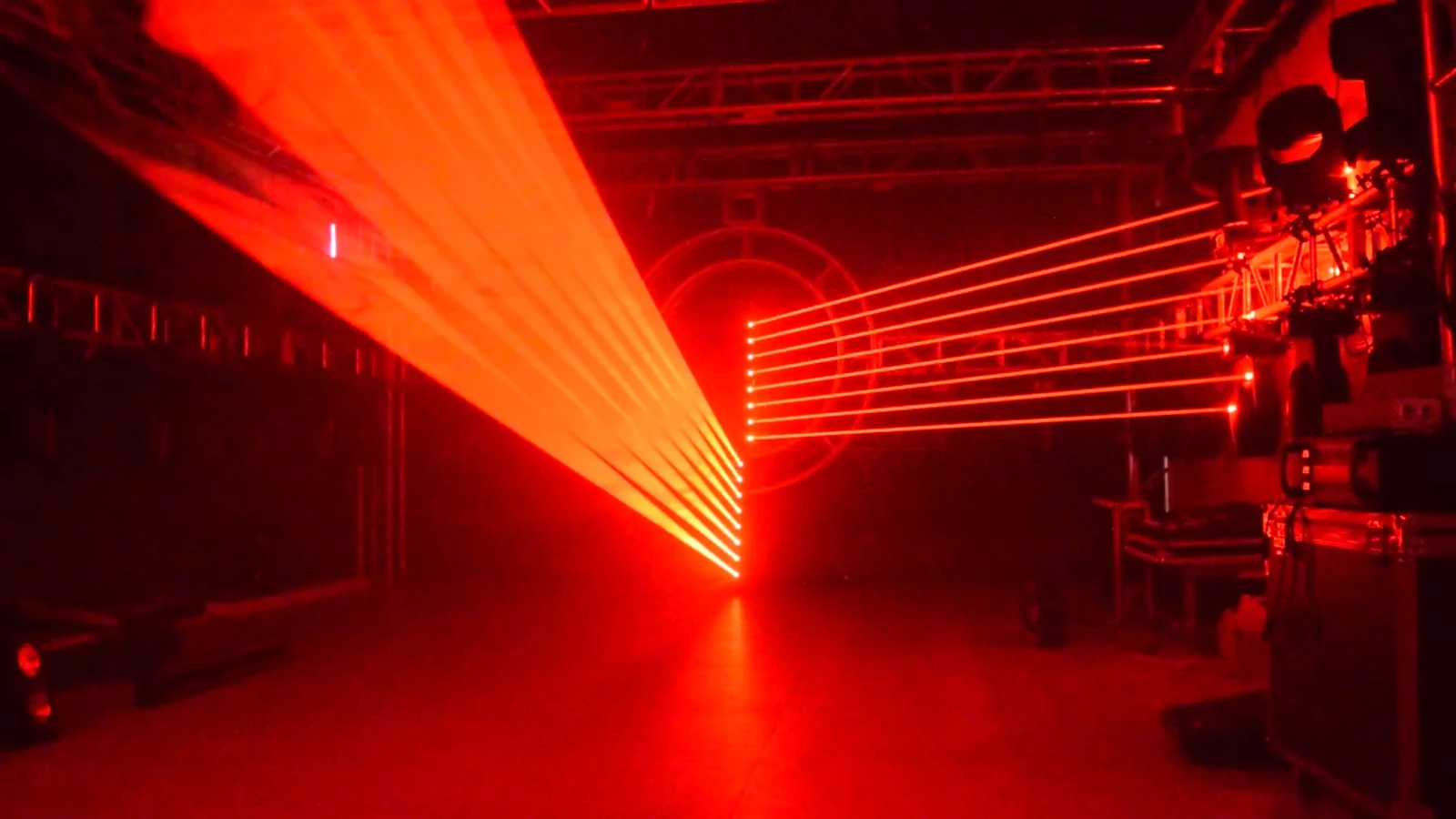 Two laser bars producing red fan and parallel-beam looks in a demonstration